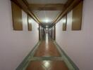 long hallway in a building with tiled floor