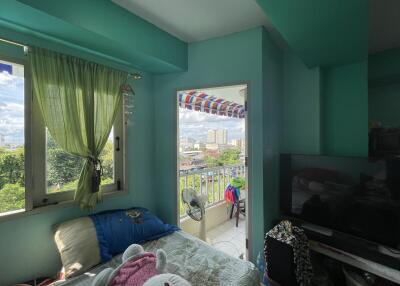 Cozy bedroom with a window and balcony access