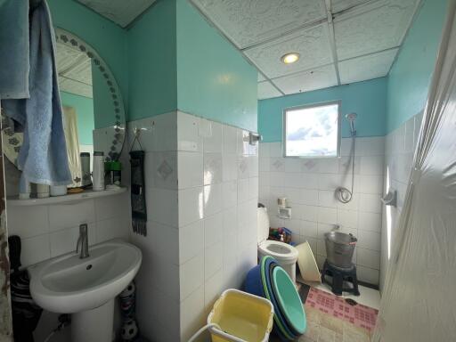 Bathroom with sink, mirror, and shower area