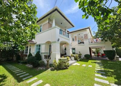 Two-story house with a garden