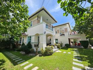 Two-story house with a garden