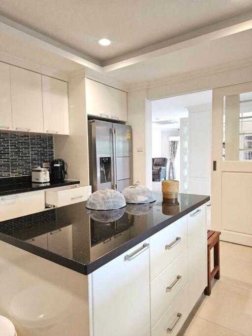 Modern kitchen with black countertop