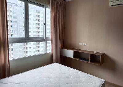 Spacious Bedroom with Large Window and Air Conditioning