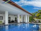 Outdoor swimming pool area with lounge chairs and covered patio