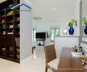 Bedroom with desk and shelving