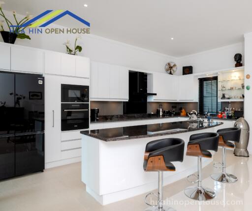 Modern kitchen with sleek design and bar seating