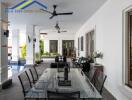 Outdoor dining area with glass table and chairs