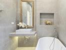 Modern bathroom with bathtub, sink, and decorative elements