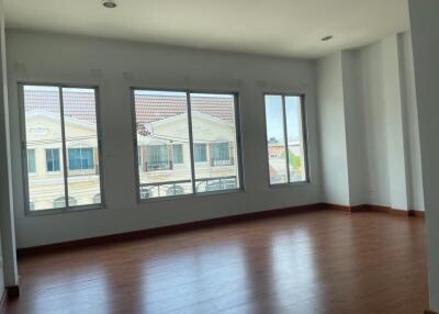 Unfurnished room with large windows