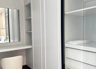 Bedroom with wardrobe and vanity area