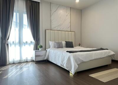 Spacious and well-lit bedroom with modern decor