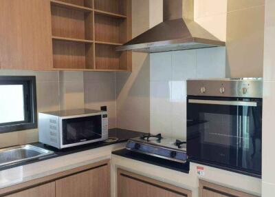 Modern kitchen with built-in appliances and cabinetry