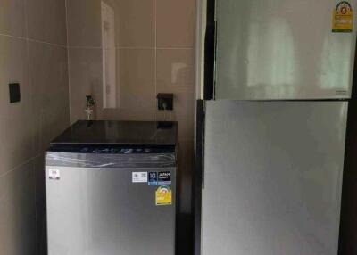 Washing machine and refrigerator in kitchen