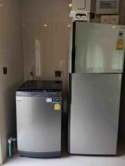 Washing machine and refrigerator in kitchen