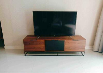 Living room with TV stand and flat-screen TV