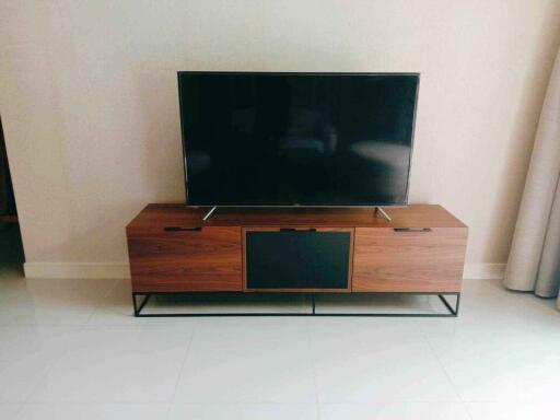 Living room with TV stand and flat-screen TV