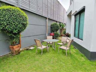 Outdoor seating area with table and chairs