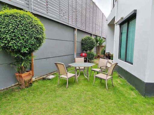 Outdoor seating area with table and chairs