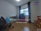 Bedroom with wooden floor, stroller, table, curtains, and shelving