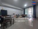 Living room with dining area and large window