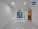 Empty living space with glossy tiled floor and recessed lighting