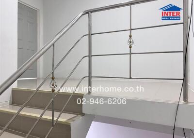 Staircase with metal railings in a property