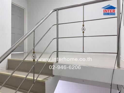 Staircase with metal railings in a property