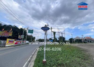 Street view with road signs and real estate advertisements