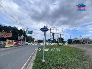 Street view with road signs and real estate advertisements