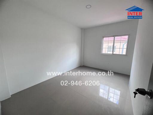 Empty room with window and tiled floor