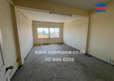 Unfurnished room with large window and concrete floor