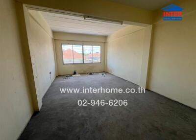 Unfurnished bedroom with large window