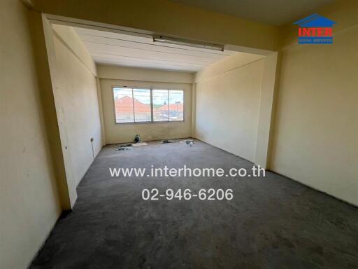 Unfurnished bedroom with large window