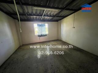 Empty room with concrete floor and window