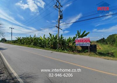 Roadside view of available land for sale