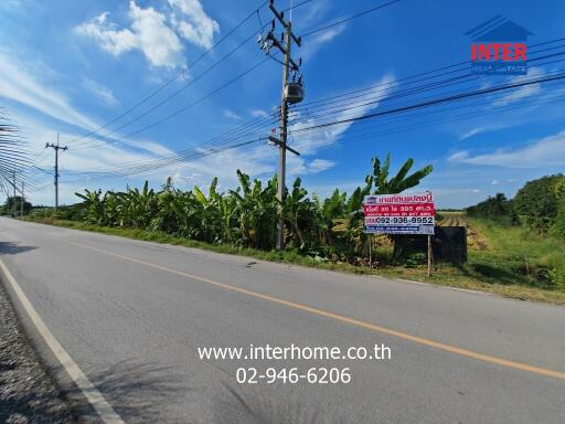 Roadside view of available land for sale