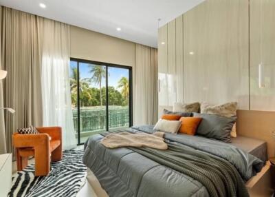 Modern bedroom with large bed, floor-to-ceiling windows, and balcony view.