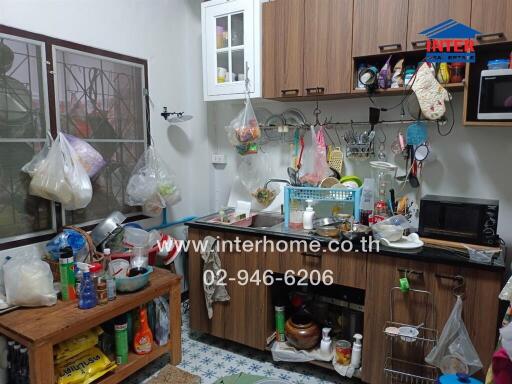 A fully equipped kitchen with various utensils and appliances