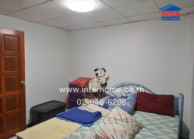 Bedroom with bed and stuffed animals