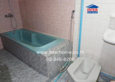 Bathroom with bathtub and shower