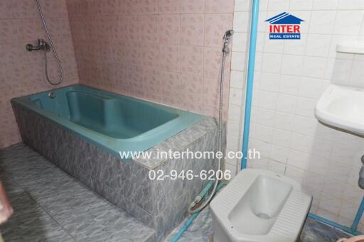 Bathroom with bathtub and shower