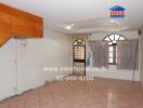 Living room with tiled flooring and wooden accents