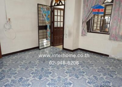 Interior view of a room with tiled floor and doorway