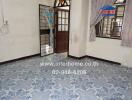 Interior view of a room with tiled floor and doorway