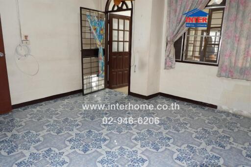 Interior view of a room with tiled floor and doorway