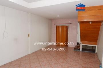 Open area with tiled floor and wooden accents