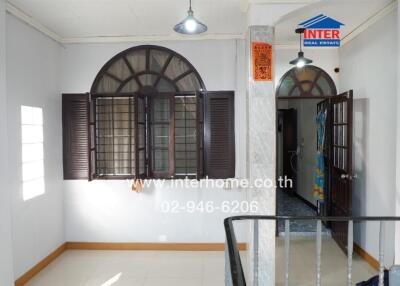 Main living area with windows and door