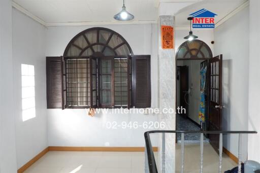 Main living area with windows and door