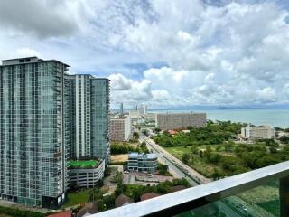 View of high-rise buildings and coastline from balcony