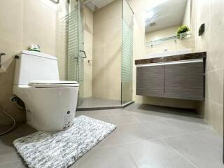 Modern bathroom with glass shower and vanity